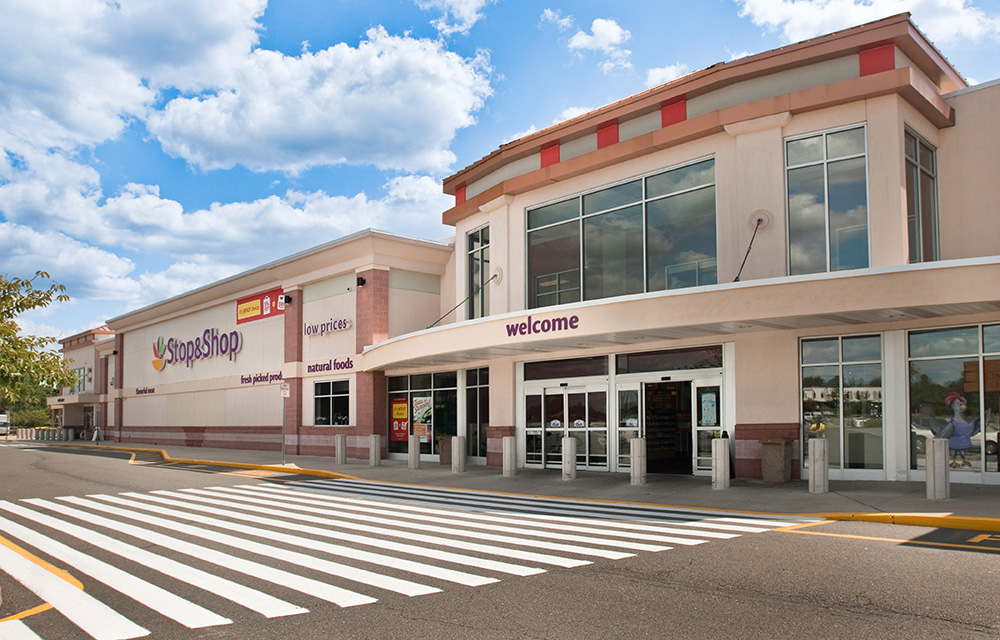 Vasconcellos of Levin Management Corp. signs Wingstop at Rutgers Plaza